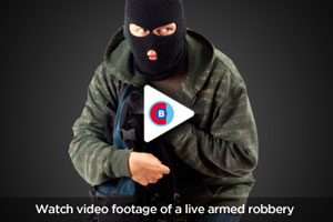 Watch video footage of a live armed robbery